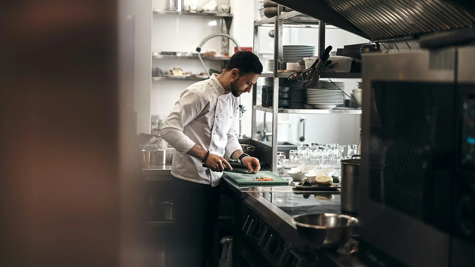 A chef at work in a professional kitchen