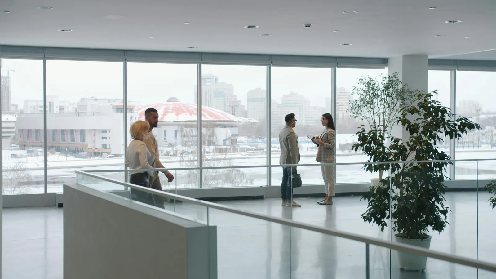People talking in a modern office lobby