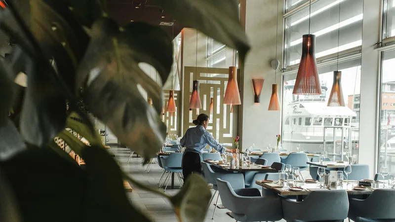 A restaurant dining room being set before service